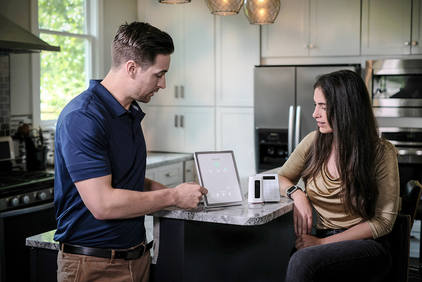 Employee talking to a customer about wireless at home security.